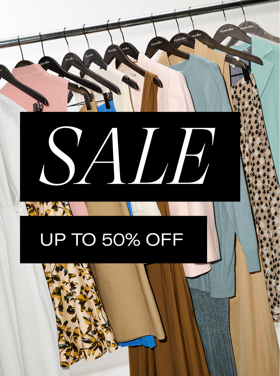 Clothing rack with various garments and a 'SALE' sign indicating up to 50% off.