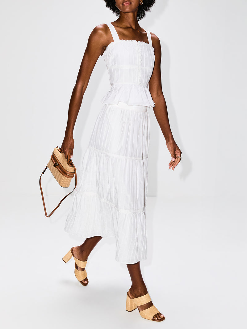 Ivory colored, mid-length, tiered skirt with elastic waistband by La Ligne